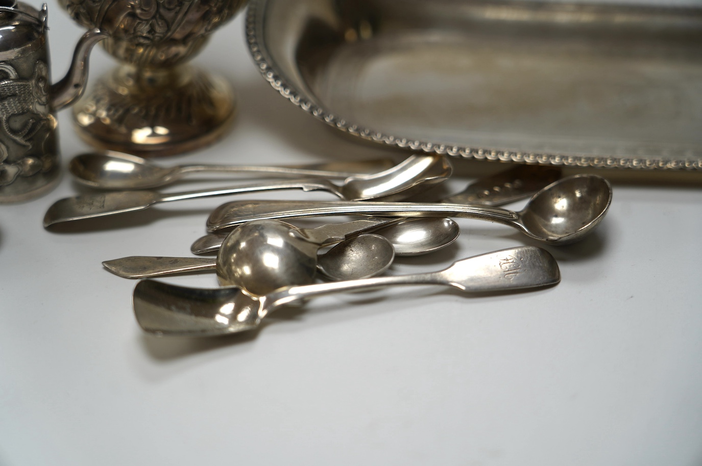 A George III silver snuffers stand, London, 1810, 22.8cm, together with sundry silver flatware, a silver sugar caster, a miniature Chinese white metal tea kettle by Wang Hing, lacking cover and one other item. Condition